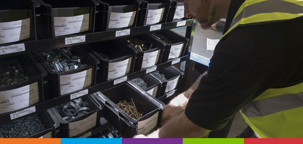 Person Looking Through Inventory Bins